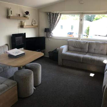 Stunning deluxe 3 bedroomed caravan with CH, DG and decking.